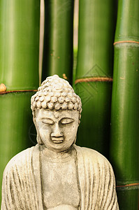 面带竹子的佛像背景图片