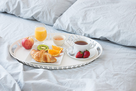奇异果茶床上早餐早餐面包枕头咖啡枕套奇异果亚麻果汁水果寝具饮料背景