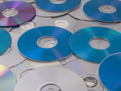 CD DVD DB 蓝光盘射线宏观光盘视频数据贮存电子产品蓝色蓝光音乐背景图片