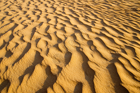 海滩沙漠沙纸质曲线黄色粮食假期宏观阴影波纹海滩涟漪海浪背景