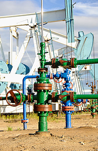 油井和泵插孔阀门钻机连接处力量工业千斤顶管道电枢机器化石背景图片