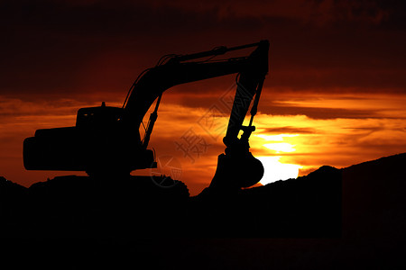 日落时大推土机的图片构造车辆力量机器拖拉机挖掘机车轮操作工业机械背景图片