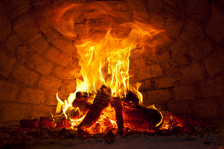点火橙子木头风险仪式篝火火焰热身燃烧黄色背景图片