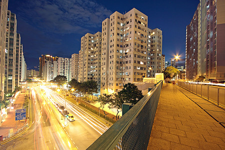 雅康高速现代城市 晚上有高速公路交通 香港州康运动建筑市中心街道旅行戏剧性日落天际蓝色旅游背景