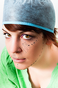 额头印记素材在年轻女性脸上划线 作为面部塑料的印记背景