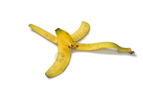 白色背景的香蕉皮食物平衡危险保险黄色护理垃圾香蕉皮肤水果背景图片