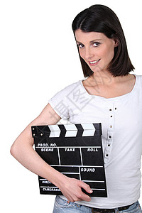 女人握着一个锁板女性艺术隔板节日摄影师顺序木板生产石板导演背景图片