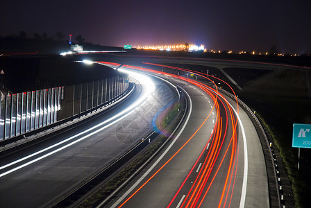 夜间高速公路  长时间曝光  灯光线城市场景汽车市中心交通景观建筑旅行车道运输背景图片