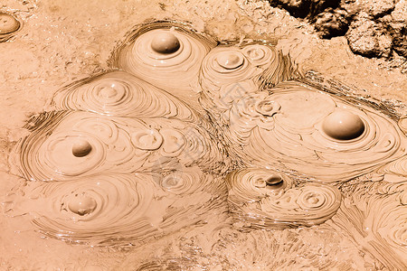 安山岩冒泡的热泥地热温泉背景蒸汽棕褐色活力宏观地球环境压力火山地理喷气背景