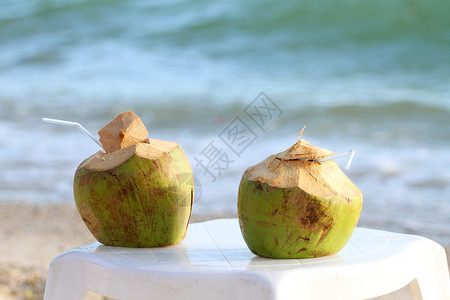椰子海滩椰椰子鸡尾酒旅行蓝色旅游海岸海滩天堂椅子坚果晴天食物背景
