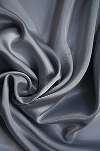 平滑 优雅银色的灰丝涟漪折痕织物丝绸投标曲线金属材料布料纺织品背景图片