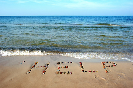 电商标题字沙滩沙滩上的文字帮助海岸绘画情感石头标题概念岩石插图铭文字母背景