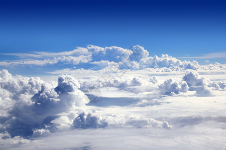从飞机云中高望蓝天地球地平线假期空气天空航班太阳航空公司晴天喷射背景图片