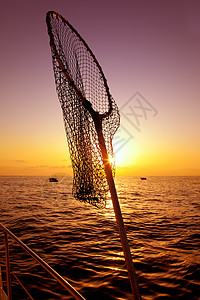 在日出盐水上渔船渔网中浸泡反射蓝色日落钓鱼波纹血管天堂晴天渔夫旅行图片