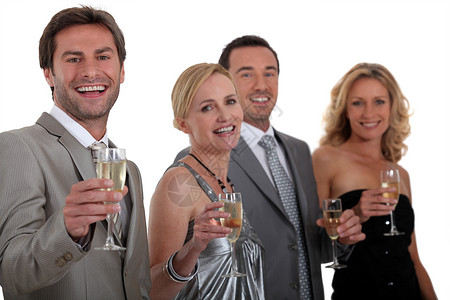喝香槟的同事们金发妻子发射玻璃女士生日干杯微笑套装庆典背景图片