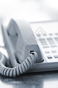 服务台电话拨号电讯会议灰色绳索呼唤桌子办公室沟通金属背景