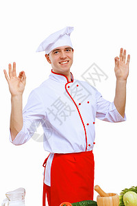 青年烹饪准备食品桌子食物酒店美食蔬菜厨房男性餐厅微笑男人背景图片