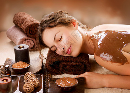 巧克力面膜巧克力面罩 奢侈品治疗女士美容师沙龙身体青年化妆师呵护护理水疗女孩背景