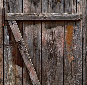旧木门背景锁孔木板裂缝剥皮粮食材料艺术控制板木头高清图片