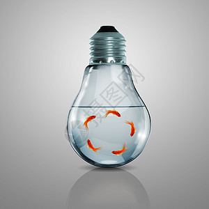 灯鱼电灯泡里有金鱼技术蓝色环境智力游泳想像力创新玻璃亮度金属背景