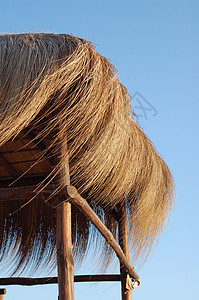盖屋顶人稻草棚干草热带阴影天空阳伞材料晴天海滩太阳小屋背景