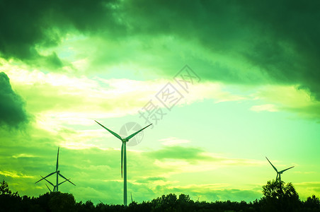 美丽日落时的风涡轮素自然天空力量太阳蓝色生态风力活力风车环境背景图片