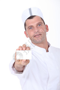 餐饮厨师名片持有空白名片的厨师男性美食帽子职业贸易奉献烹饪工作室卡片厨房背景