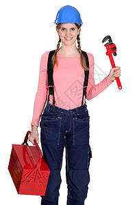 拿扳手女孩拥有工具箱的妇女盒子工作工具服装工人服务冒充维修活动女孩背景