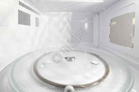 微波内部电气用具白色转盘电子家庭盘子厨具工具厨房背景图片