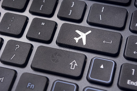 在线订机票 键盘上标有飞机标志互联网飞行按钮网站客票手续纽扣商业交通工具电子背景