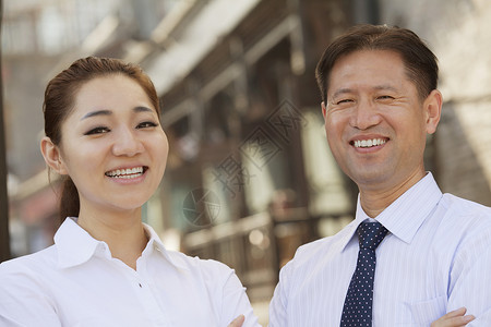 拉领带女人北京市户外两个商务人士的肖像背景