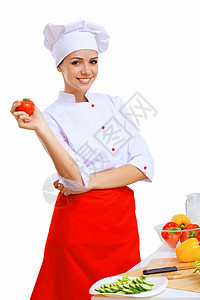 青年烹饪准备食品围裙微笑桌子男性男人成人职业美食盘子餐厅背景图片