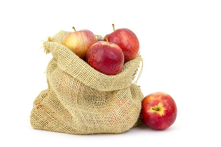 红色麻布袋子带苹果的布拉普麻袋解雇果汁营养饮食麻布农业生态乡村白色季节性背景