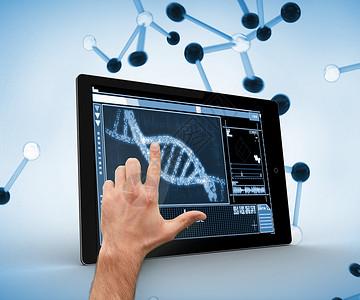 用手触摸数码平板电脑上的DNA背景图片