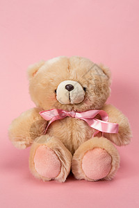 泰迪熊带粉色丝带背景图片