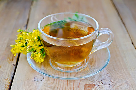 撵茶图素材托桑的草药茶 在板上的玻璃杯里背景