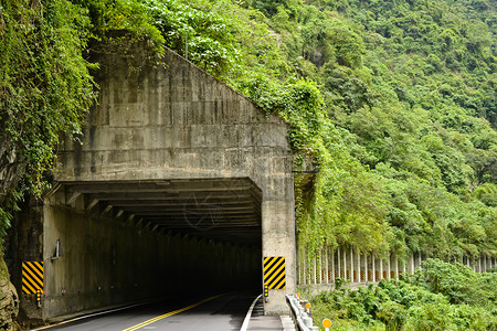 通过废线隧道山区公路隧道走廊管子橙子小路岩石速度叶子街道路线入口背景