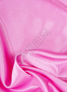 平滑优雅的粉色丝绸作为背景曲线海浪材料薰衣草纺织品织物布料婚礼投标背景图片