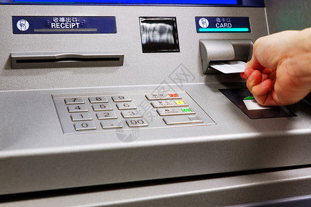 自动终端自动取款机中的插入卡银行顾客金融信用现金技术银行业代码安全别针背景