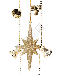 圣诞金色的花冠 有星星和钟声季节性金子装饰品假期花环火花细绳背景图片