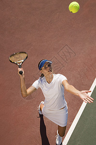体育项目打网球在法庭打网球的体育服女青年的高角度视角背景