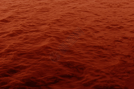 红水表面海景反射液体波纹红色背景图片