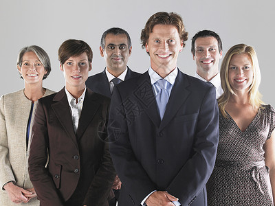一群笑笑的商务人士半身管理人员小群人正装人士力量双手经理合作女士背景图片