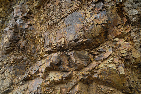 火山岩黑色建筑学材料火山石头宏观灰色风化棕色花岗岩背景图片