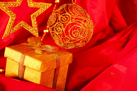 星星装饰金色圣诞节装饰和礼品派对织物庆典背景礼物金子季节玩具盒子团体背景