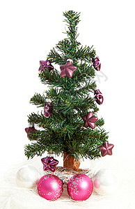 带有紫色恒星的塑料圣诞树粉色庆典季节性季节绿色植物白色假期背景图片