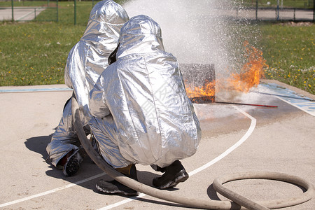 消防员培训服务水带喷涂消防消防服安全火焰训练情况危险背景图片