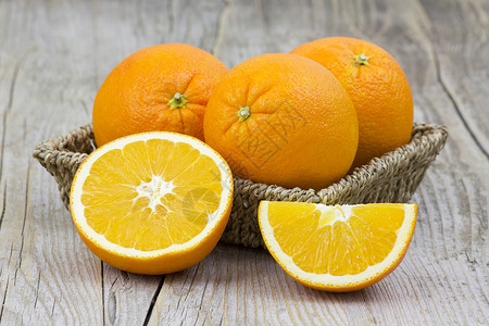 片篮子里的茼蒿图片篮子里的新鲜橙子饮食宏观花园桌子食物季节水果水平热带果汁背景
