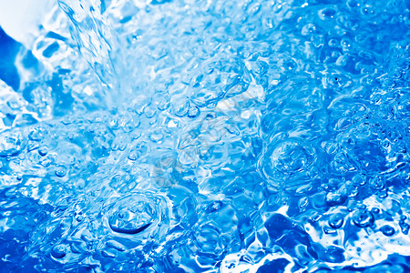 蓝水流动气泡宏观波纹海浪运动飞溅液体背景图片