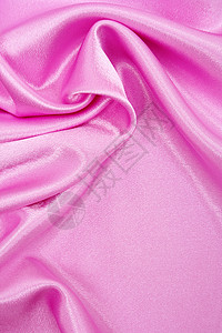 平滑优雅的粉色丝绸作为背景布料织物曲线婚礼薰衣草投标材料海浪纺织品背景图片